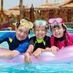 LuxeGetaways - 25 Poolside Experiences - Luxury Hotel Pools - kids in pool